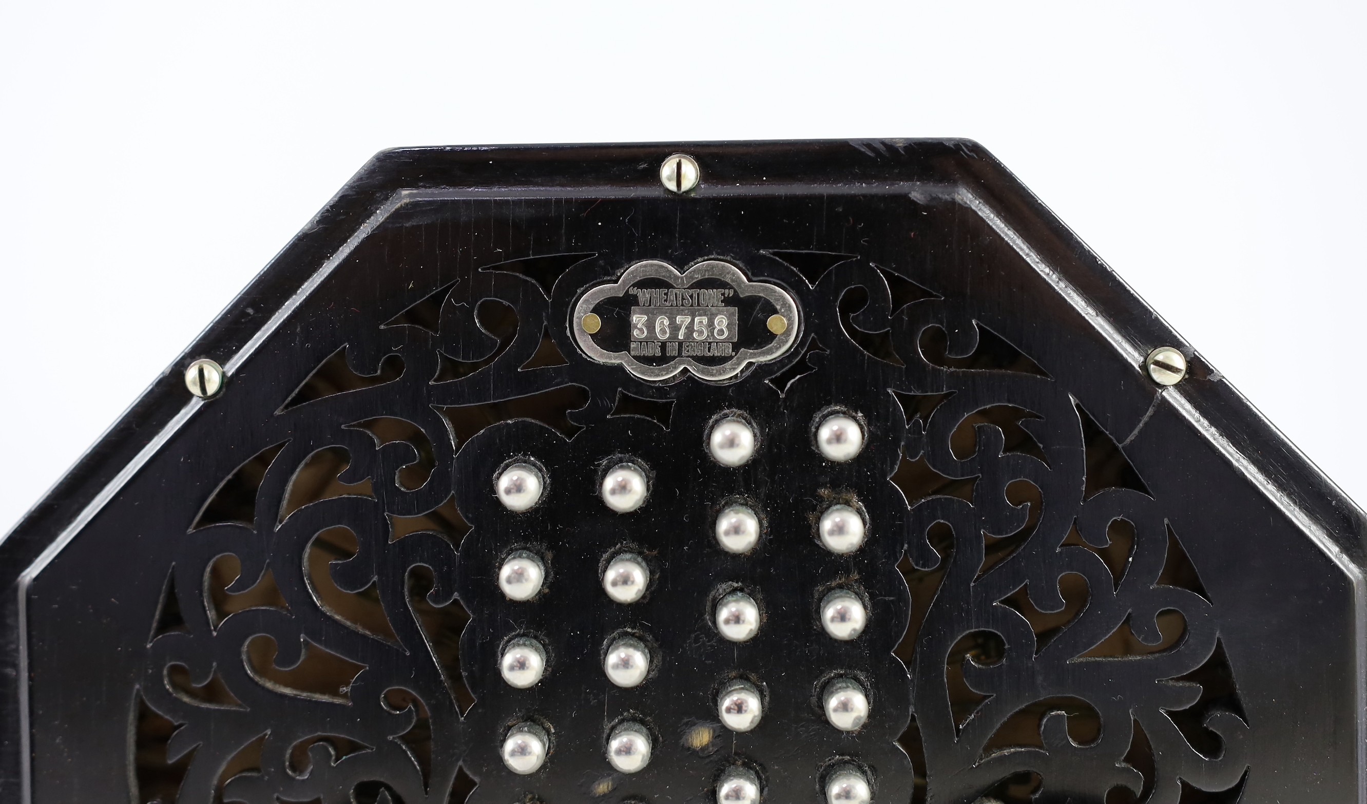 PLEASE NOTE 57 KEYS. A Wheatstone 'English' Model No. 5E 57 key concertina, diameter 17cm, with original leather case